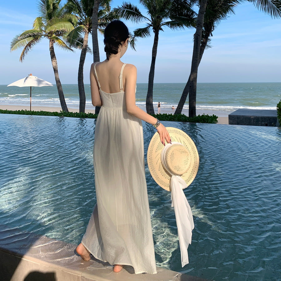 2025 Super fairy seaside vacation style design sense hollow sleeveless suspender dress summer new slim and thin skirt