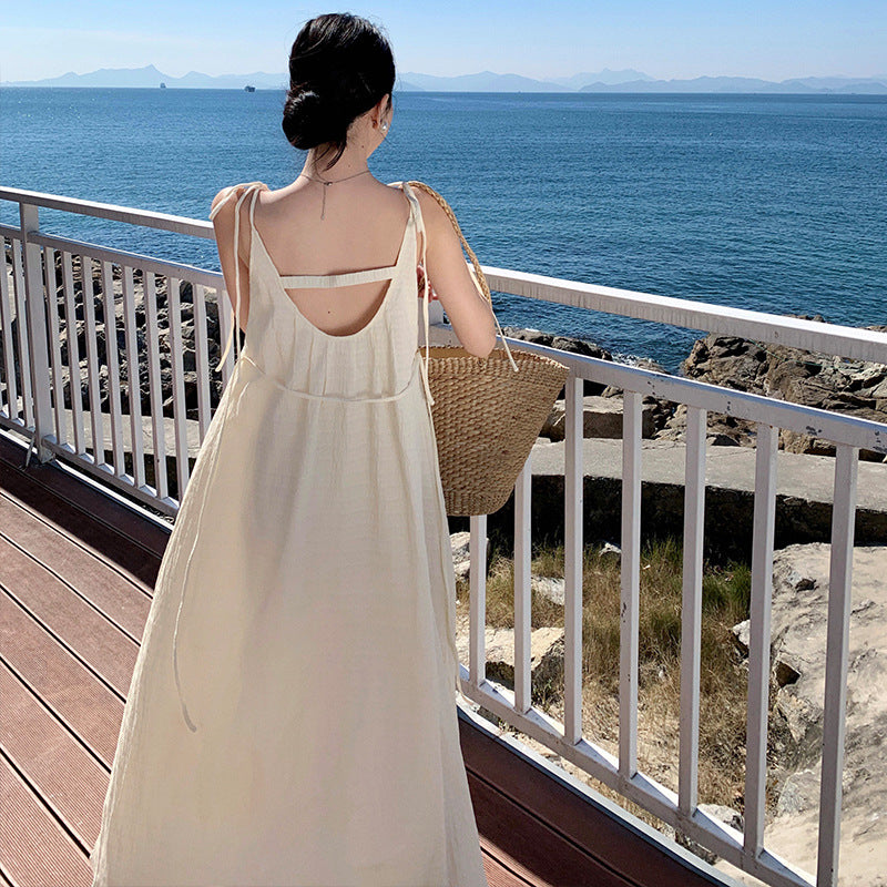 2025 Super good-looking casual vacation suspender dress women's summer temperament texture dark pattern loose backless long skirt