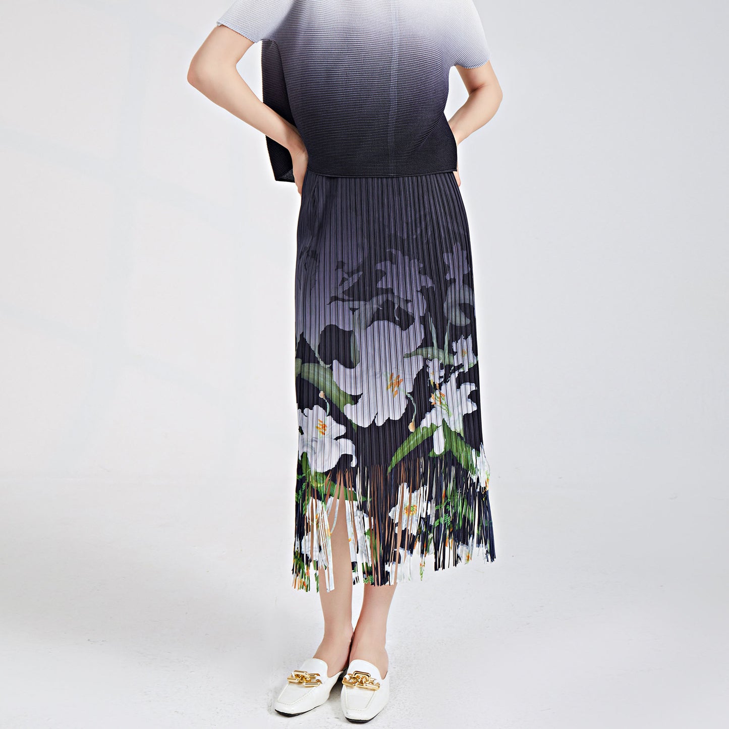 recommends a fringed skirt for women's summer new elastic waist printed commuter versatile pleated hip skirt