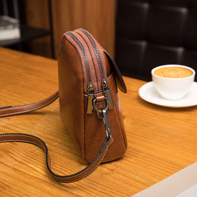 2025 Oil wax leather mobile phone bag soft leather oblique span vertical shoulder bag trendy simple new summer small bag versatile women's bag