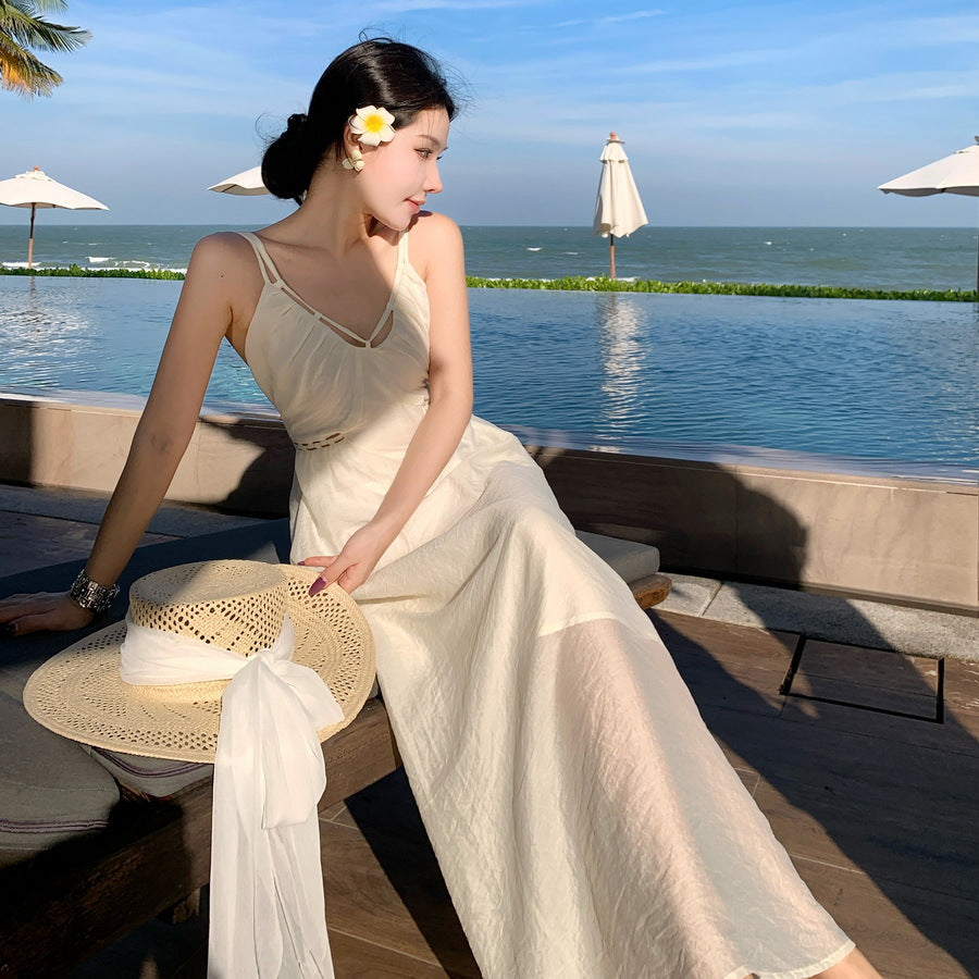 2025 Super fairy seaside vacation style design sense hollow sleeveless suspender dress summer new slim and thin skirt
