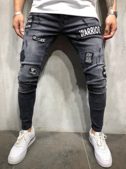 2025 Hot trade  denim new men's tight jeans black ripped badge patch small feet denim men's pants