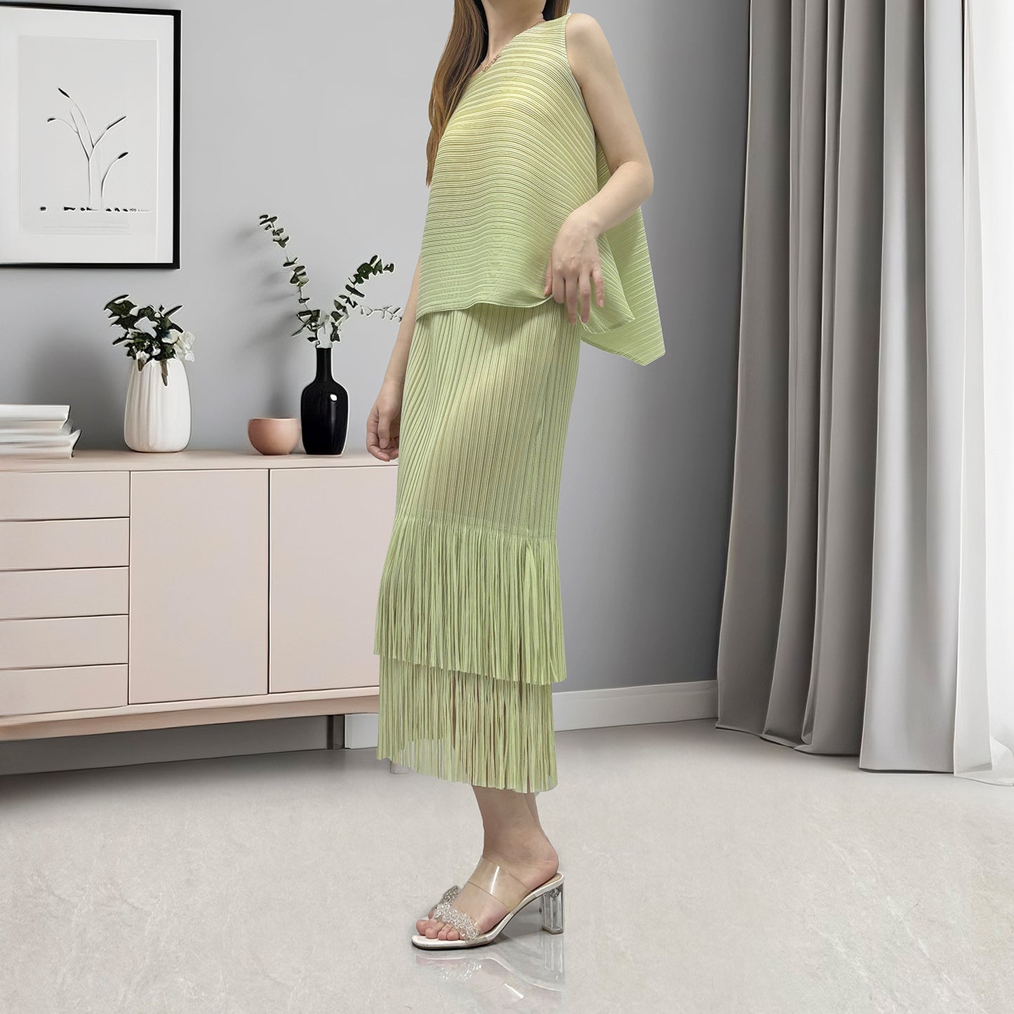 Hot-selling women's clothing with a complete set of temperament irregular sleeveless T-shirt fringed hip skirt two-piece set