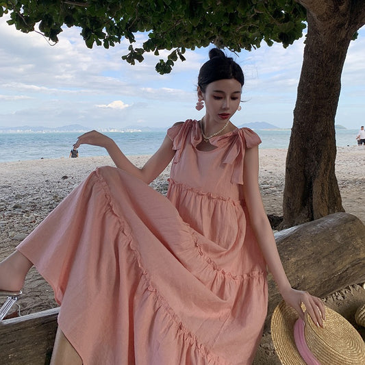2025 Sweet pink strap dress women's summer Hainan Sanya beach skirt lazy wind loose pendant suspender dress