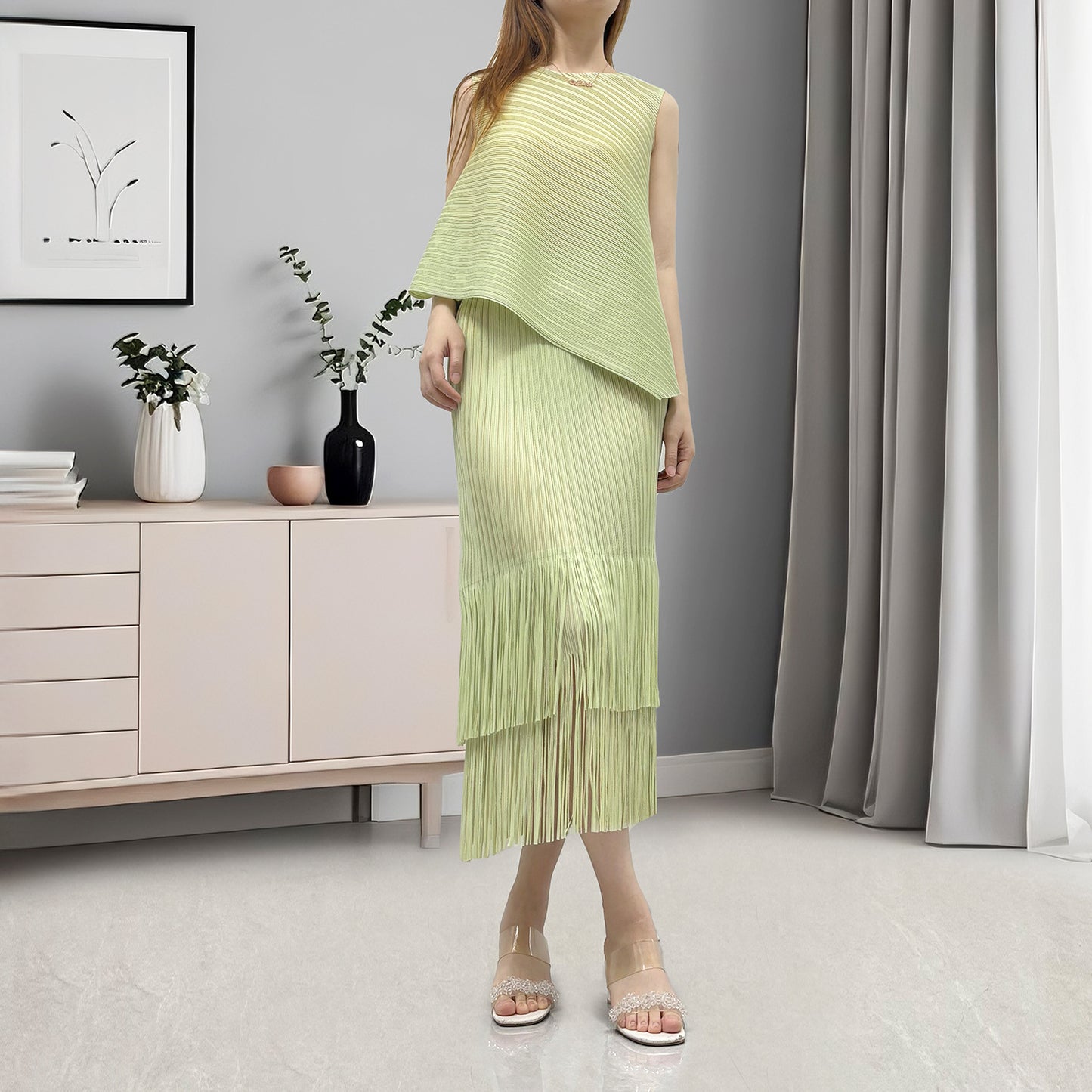 Hot-selling women's clothing with a complete set of temperament irregular sleeveless T-shirt fringed hip skirt two-piece set